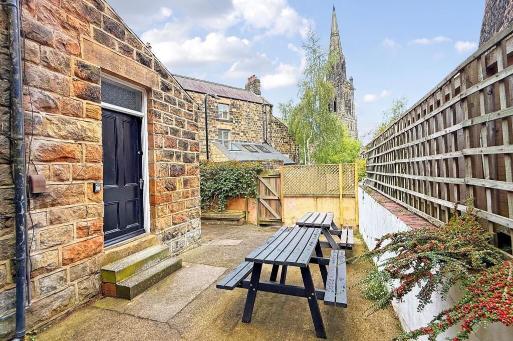 Garden terrace with church views at group house Harrogate